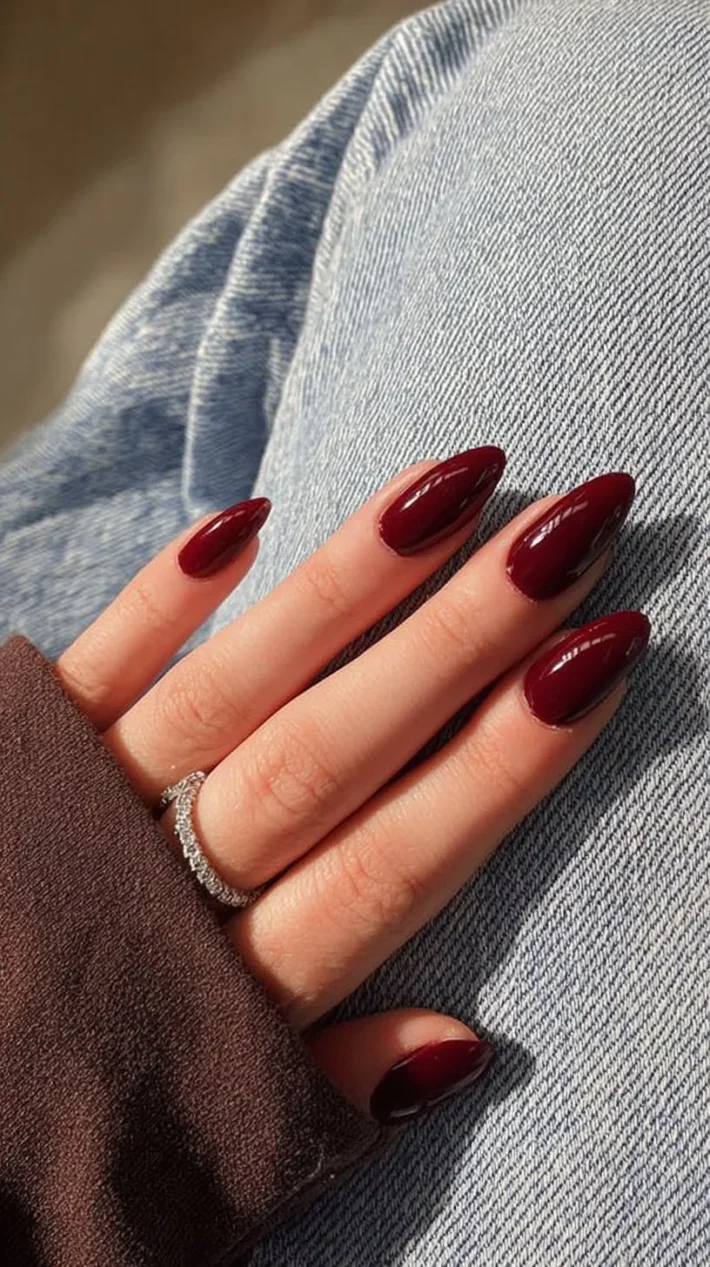 A collection of stunning red nail designs showcasing various patterns and styles.