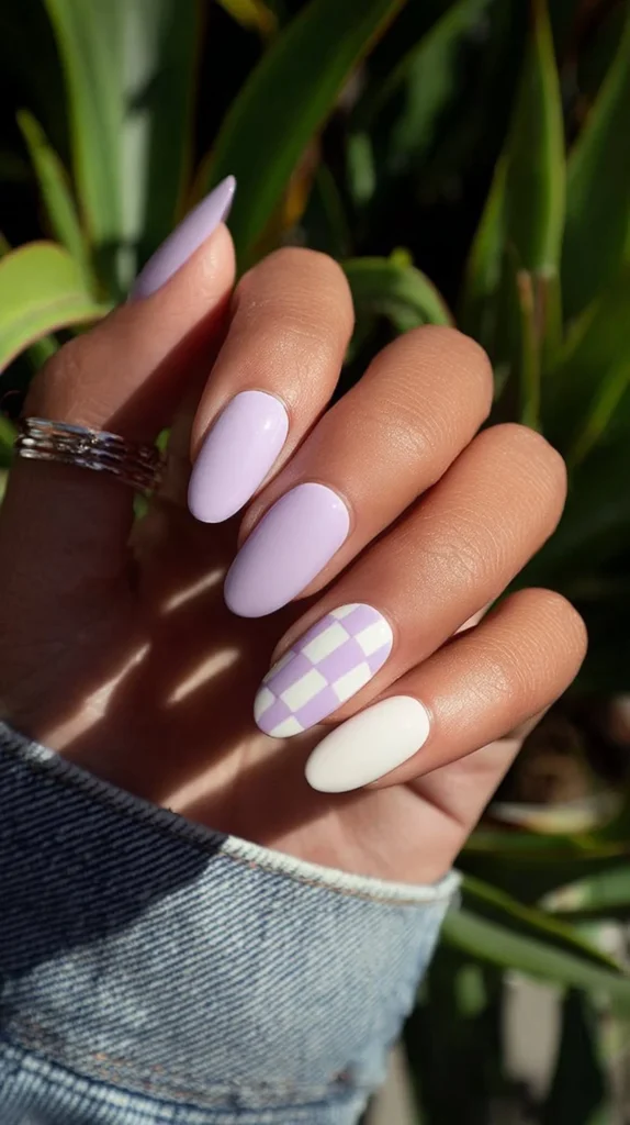 Neon peach nails featuring miniature heart decals for a trendy manicure.