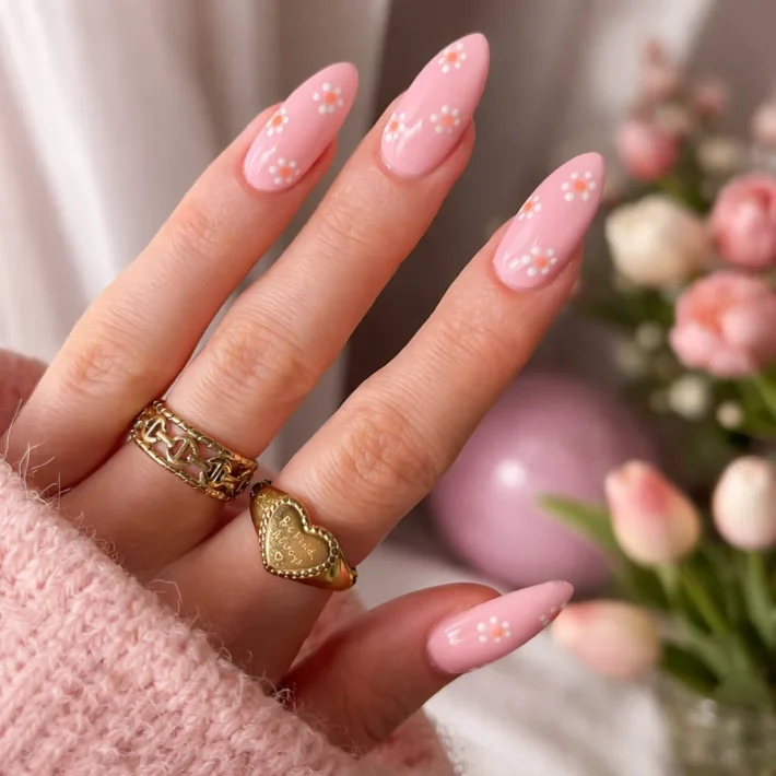 Cute and simple spring nails featuring floral designs and pastel colors.