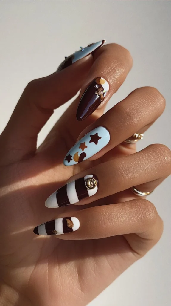 Chocolate brown and blue press on nails with stars, stripes, and polka dots design.