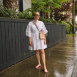 Woman styling a jelly shoes outfit, showcasing colorful fashion and summer vibes.