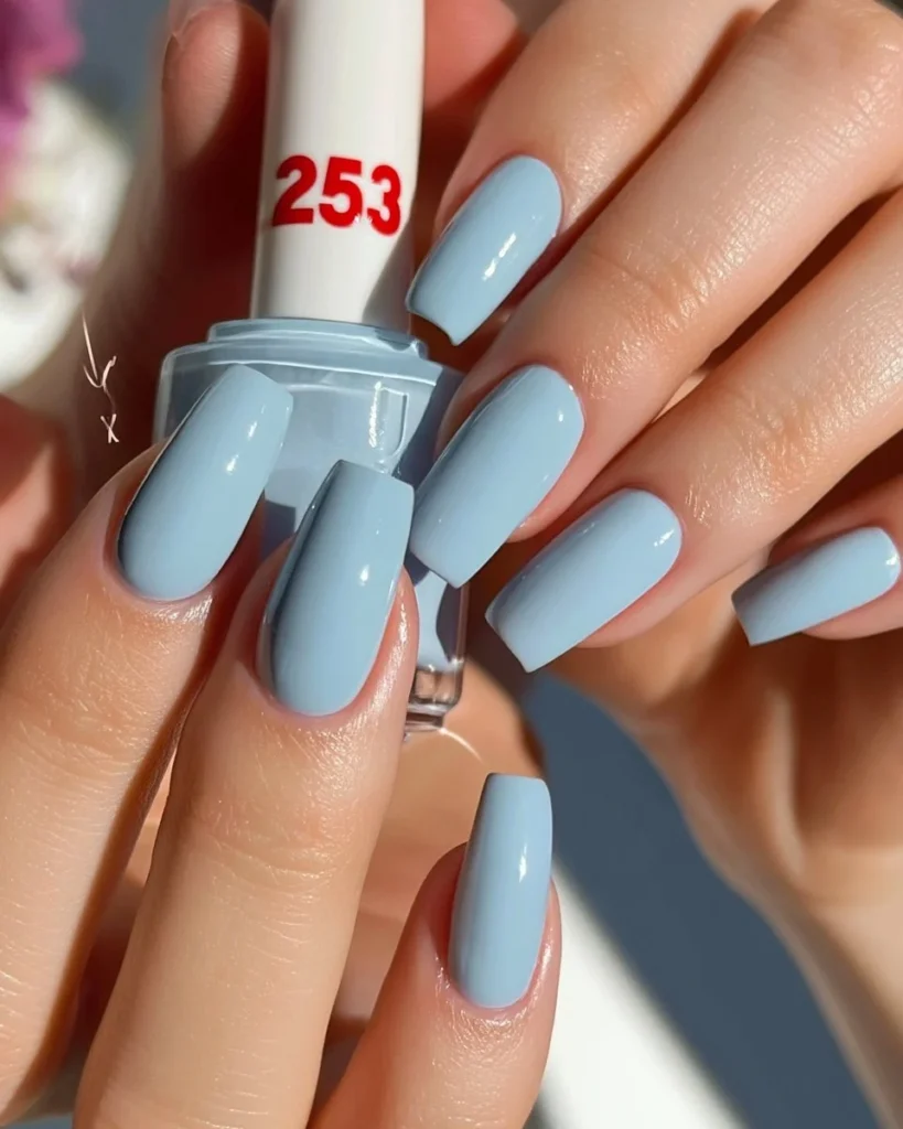 Spring flower nails design with light blue color and floral accents for a minimal look.